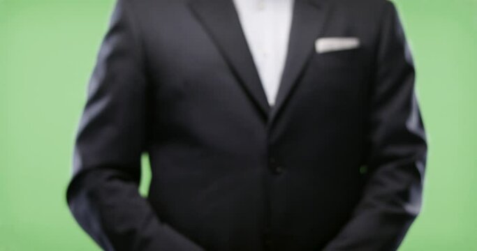 Businessman uses fingerprint scanner. Shot on Green Screen. Fingerprint scanner used by a businessman in a suit on green keyable background. Shot in slow-motion in 4k.