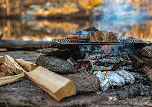 Tomahawk steak over the campfire 