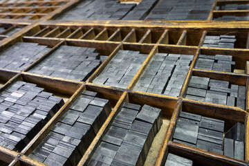 Printing drawer with grids to organize the types of lead that are inside, old typefaces, vintage concept