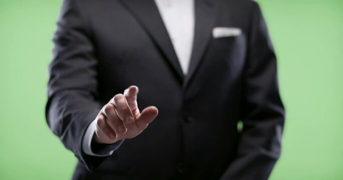 Businessman using Augmented reality touch display. Shot on green screen in 4k.