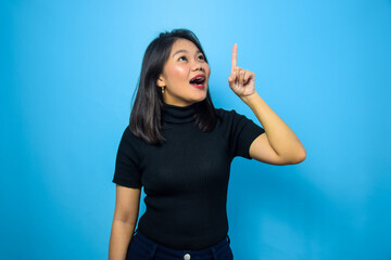 Fototapeta premium Portrait of Young beautiful asian women wearing black turtle neck shirt with blue isolated background