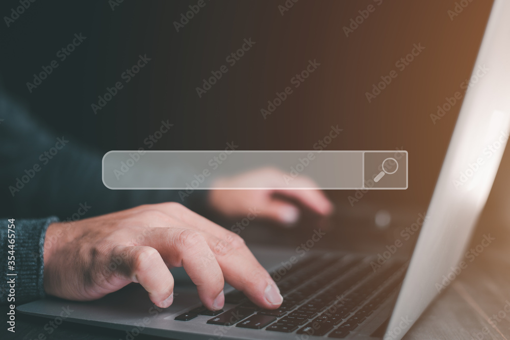 Leinwandbilder Data Search Technology Search Engine Optimization. man's hands are using a computer notebook to Searching for information.Using Search Console with your website.