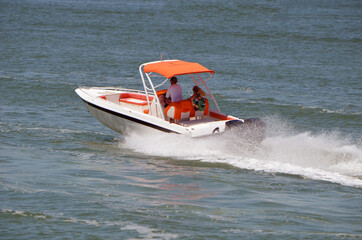 Fototapeta premium Sporty runabout motor boat powered by two outboard engines.
