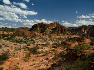 Arid desert landscape view. Red sandstone, mountain and canyon valley in Sierra de las Quijadas National Park. 