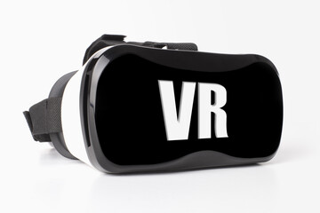 virtual reality glasses with inscription VR over gray background
