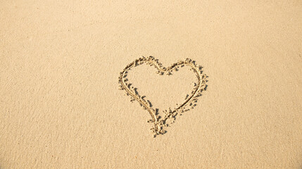 heart drawn in the sand on the beach. Romantic design element.