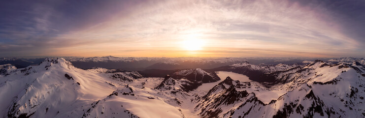 Aerial Panoramic View of Canadian Mountain Landscape during a colorful sunset. Located in Garibaldi near Whistler and Squamish, North of Vancouver, British Columbia, Canada. Nature Background Panorama