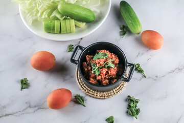 Popular Home Cooking Northern Thai meat and tomato spicy dip sauce, usually eat with fresh vegetables such as cucumber and chinese cabbage. Thai food 