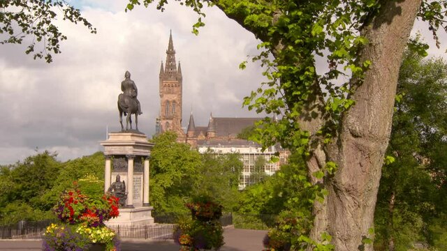Tilt down shot of Lord Roberts Monument at park near famous university in city against sky on sunny day - Glasgow, Scotland