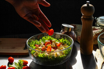 Cooking a salad of fresh vegetables, good nutrition