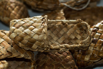 woven shoes made of wood bark from the master on the table