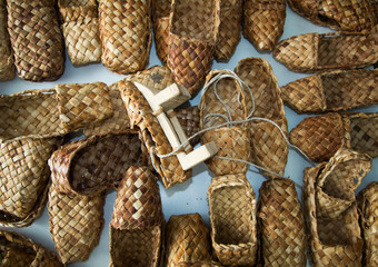 woven shoes made of wood bark from the master on the table