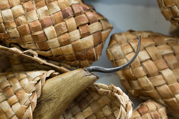 woven shoes made of wood bark from the master on the table