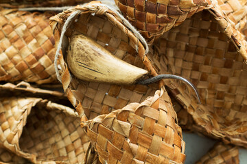 woven shoes made of wood bark from the master on the table