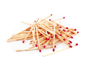 a loose pile of long wooden fireplace matches isolated on white

