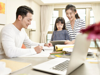 happy asian family staying at home