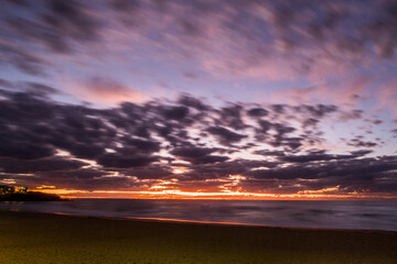 Fototapeta na wymiar clouds at the beach at sunrise