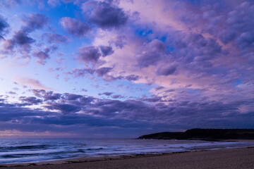 Naklejka na ściany i meble sunrise at the beach with clouds