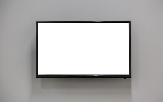 TV on the wall with a white screen.