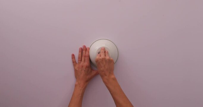 Life hack: struggling taking off a sticker, adding hot water to a white bowl to easily taking a sticker out 