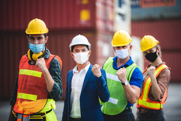 worker group with engineer, foreman, and manager are wearing medical protection face mask in industry working site, working measures to prevent the spread of the virus COVID-19