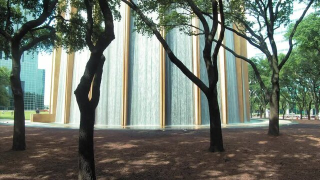 Aerial: Gerald D. Hines Waterwall Park. A 64-ft.-tall fountain circulating 11,000 gallons of water every minute. Houston, Texas, USA