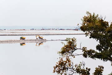 Land reclamation lorry carry sands and rocks on the shore