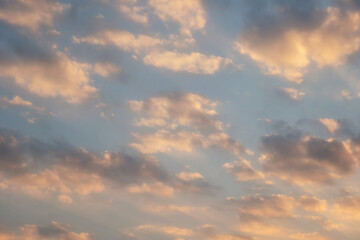 Naklejka na ściany i meble Beautiful sunset sky above clouds with dramatic light