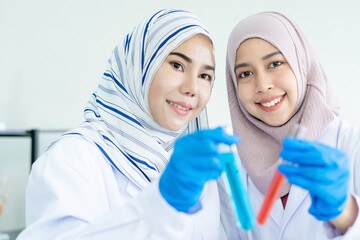 Professional chemical and pharmaceutical scientists inspecting the new medicine capsule and they making a decision together. Chemical expertise inspecting the quality of medicines. Laboratory research
