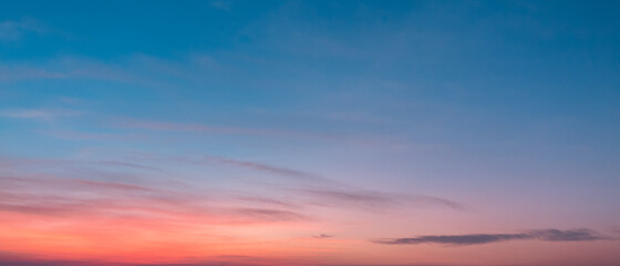 Naklejka na ściany i meble Beautiful sunset sky above clouds with dramatic light 