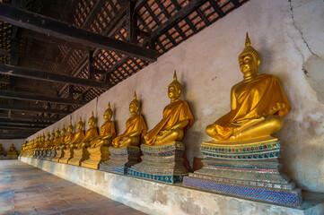 Golden statues of sitting Buddha in a row in Ayutthaya World Heritage park