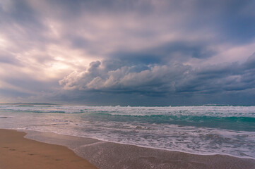 Sunrise beach landscape with sand coastline and soft waves