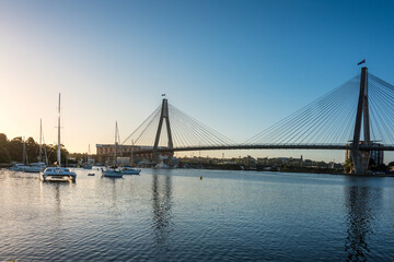 Sydney cityscape with harbor view, ANZAC bridge and boats