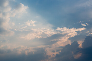 
Beautiful dramatic gray and white clouds on blue sky, variety of shapes, silhouettes and shades at sunset time
