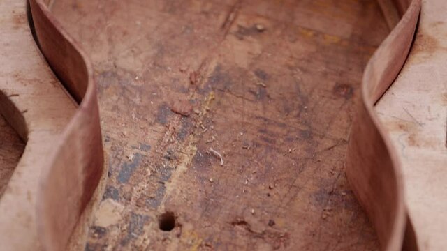 Wooden Guitar Body Frame In The Making In A Guitar Manufacturing Industry - close up