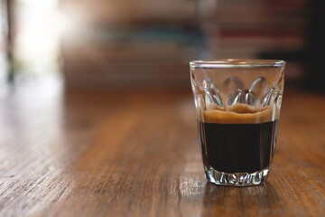 A cup of espresso coffee on wooden table