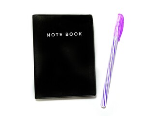 Pen and note book on white background