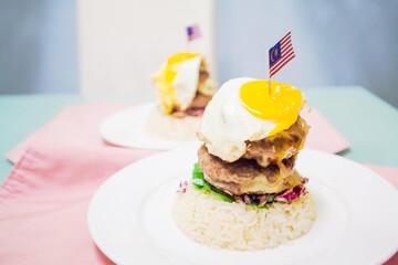 Multi layer burger view in close with Malaysia Flag on top