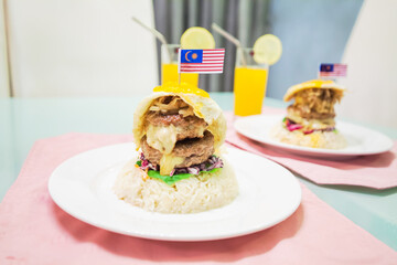 Multi layer burger view in close with Malaysia Flag on top