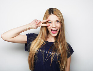 Fototapeta premium lovely woman showing victory or peace sign
