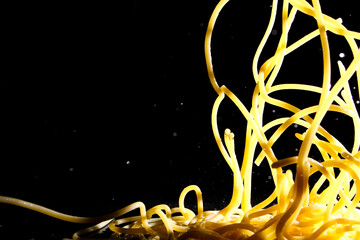 Close up of pasta on black background