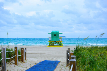 Miami Beach with lifeguard tower and coastline with colorful cloud and blue sky. South Beach. Panorama of Miami Beach, Florida.