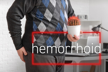 Elderly man with cactus in office. Hemorrhoids concept