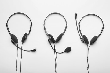 Modern headsets on white background
