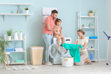 Family doing laundry at home
