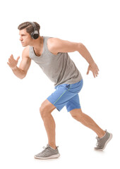 Sporty running young man on white background