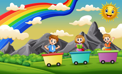 Obraz na płótnie Canvas Happy children riding train on the field
