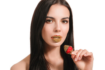 Sexy young woman with strawberry on white background