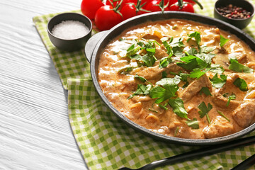 Tasty beef stroganoff on table