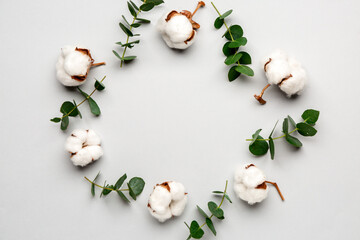 Composition with beautiful cotton flowers on light background